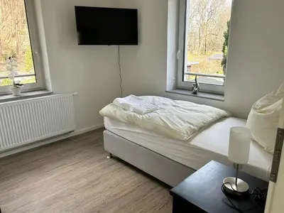 Ein Bett oder Betten in einem Zimmer der Unterkunft Schönherrstrasse