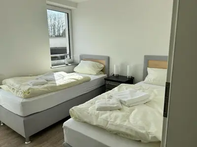 Ein Bett oder Betten in einem Zimmer der Unterkunft Schönherrstrasse