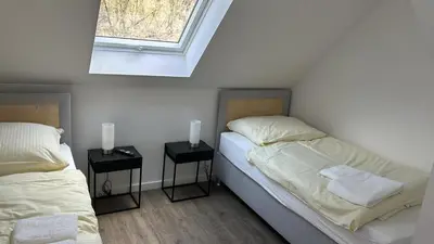 Ein Bett oder Betten in einem Zimmer der Unterkunft Schönherrstrasse