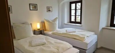Ein Bett oder Betten in einem Zimmer der Unterkunft Schlossstrasse