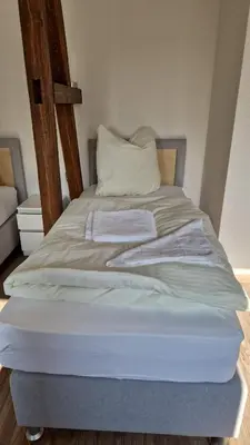 Ein Bett oder Betten in einem Zimmer der Unterkunft Schillerstrasse