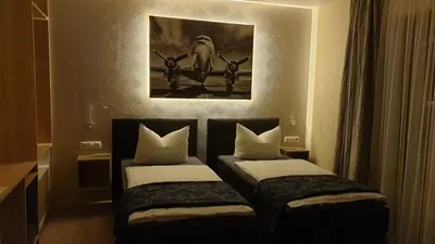 Ein Bett oder Betten in einem Zimmer der Unterkunft Ferienapartments Pension Elsternest