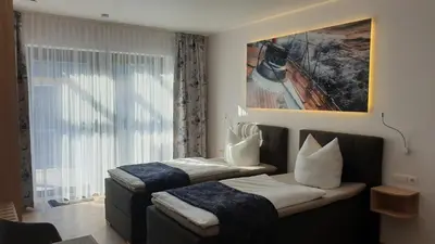 Ein Bett oder Betten in einem Zimmer der Unterkunft Ferienapartments Pension Elsternest