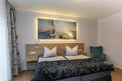 Ein Bett oder Betten in einem Zimmer der Unterkunft Ferienapartments Pension Elsternest