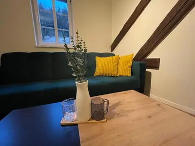 Ein Sitzbereich in der Unterkunft Ferienwohnung Kohlbornsteinblick am Malerweg