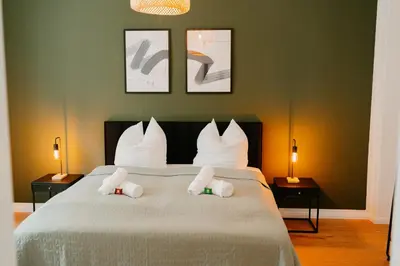 Ein Bett oder Betten in einem Zimmer der Unterkunft Ferienwohnung Elbzauber für 6 l Parkplatz l Balkon