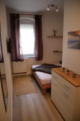 Ein Bett oder Betten in einem Zimmer der Unterkunft Ferienwohnung am Windberg