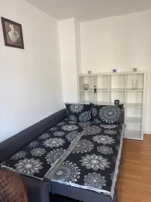 Ein Bett oder Betten in einem Zimmer der Unterkunft A&A Apartments