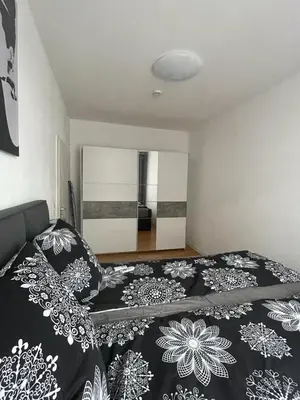 Ein Bett oder Betten in einem Zimmer der Unterkunft A&A Apartments