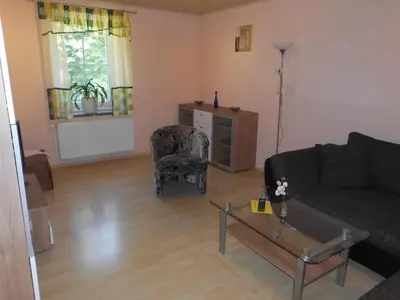 Ein Sitzbereich in der Unterkunft Apartment Sayda 2