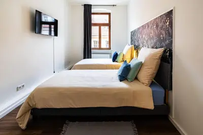 Ein Bett oder Betten in einem Zimmer der Unterkunft Design Altstadtperle mit 2 Schlafzimmer- 6 Personen-Waschmaschine - Parkplatz-Infrarotkabine