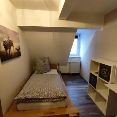 Ein Bett oder Betten in einem Zimmer der Unterkunft Ferienwohnung am Markt in Olbernhau