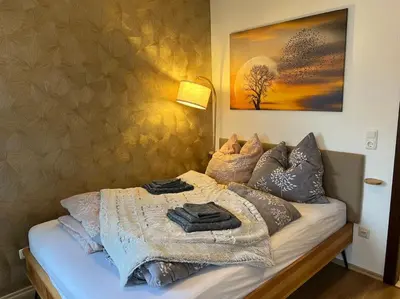 Ein Bett oder Betten in einem Zimmer der Unterkunft Cozy Suite Dresden