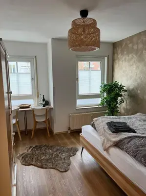 Ein Bett oder Betten in einem Zimmer der Unterkunft Cozy Suite Dresden