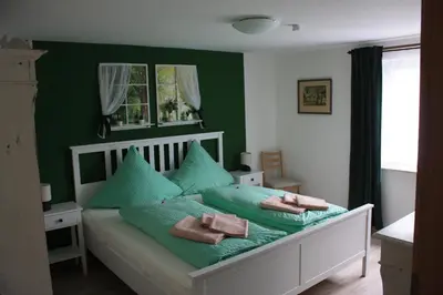 Ein Bett oder Betten in einem Zimmer der Unterkunft Fewo Am Geyersberg