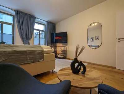 Ein Bett oder Betten in einem Zimmer der Unterkunft Royal Apart Chemnitz 1 - Terrasse nahe Zeisigwald
