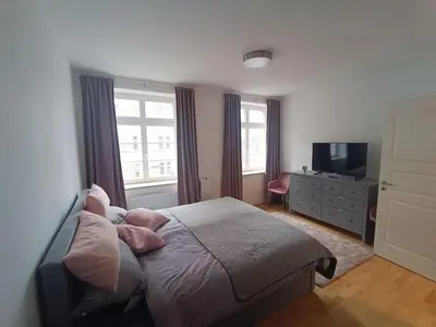 Ein Bett oder Betten in einem Zimmer der Unterkunft FeWo an den Elbwiesen neben der Altstadt