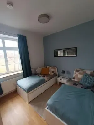 Ein Bett oder Betten in einem Zimmer der Unterkunft FeWo an den Elbwiesen neben der Altstadt