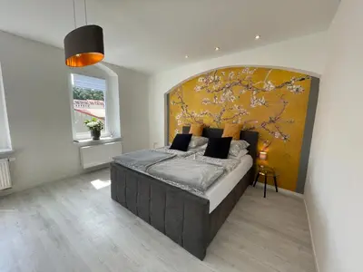 Ein Bett oder Betten in einem Zimmer der Unterkunft Traumhaftes Meißen mit Burg-und Elbblick No1