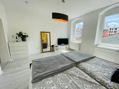 Ein Bett oder Betten in einem Zimmer der Unterkunft Traumhaftes Meißen mit Burg-und Elbblick No1