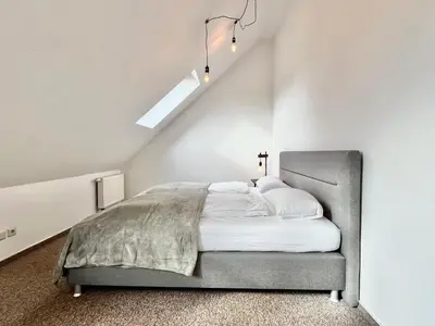 Ein Bett oder Betten in einem Zimmer der Unterkunft Modernes Apartment mit Blick zur Elbe