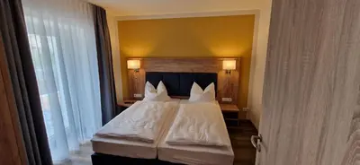 Ein Bett oder Betten in einem Zimmer der Unterkunft Ferienwohnungen SATKULA