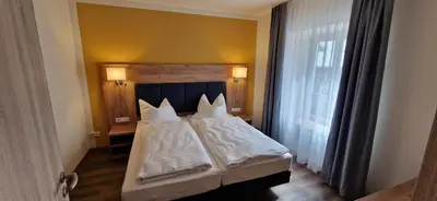 Ein Bett oder Betten in einem Zimmer der Unterkunft Ferienwohnungen SATKULA