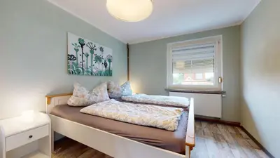 Ein Bett oder Betten in einem Zimmer der Unterkunft Karls Ferienhaus