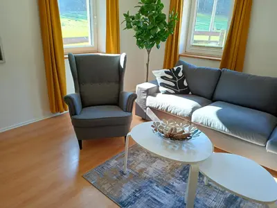 Ein Sitzbereich in der Unterkunft Ferienwohnung Wandersfreud