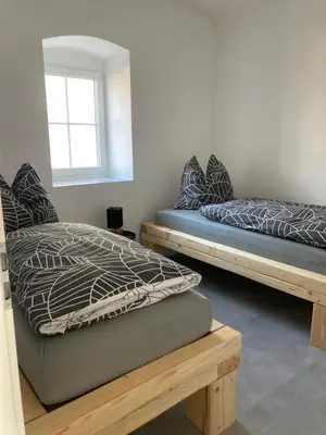 Ein Bett oder Betten in einem Zimmer der Unterkunft Ferienwohnung Zweinig 04