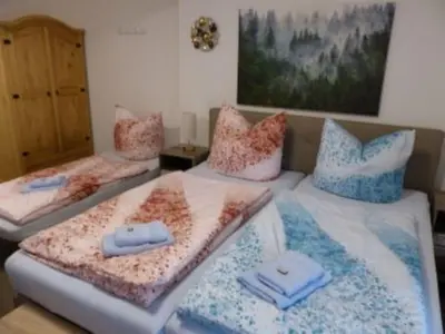 Ein Bett oder Betten in einem Zimmer der Unterkunft Ferienwohnung in 09548 Seiffen bis maximal 18 Personen