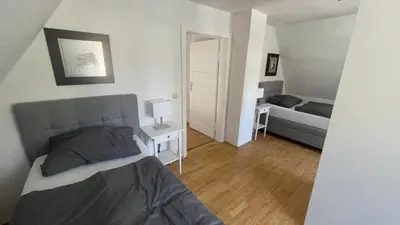 Ein Bett oder Betten in einem Zimmer der Unterkunft Ferienhaus am weißen Adler