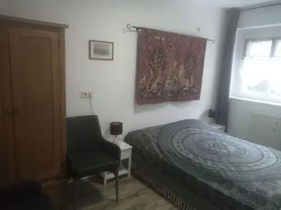 Ein Bett oder Betten in einem Zimmer der Unterkunft ELBENLAND SÄCHSISCHE SCHWEIZ II - Komfortable 2-Raum-Wohnung im Herzen der sächsischen Schweiz