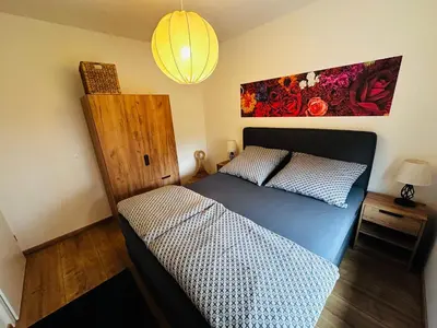 Ein Bett oder Betten in einem Zimmer der Unterkunft Fischis Ferienwohnung Struppen