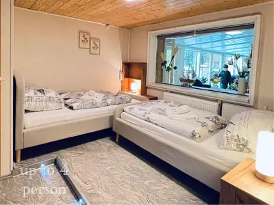 Ein Bett oder Betten in einem Zimmer der Unterkunft Ferienhaus am Elberadweg mit Sauna & Kamin - Natur, Erholung & S-Bahn-Anbindung - Saxon Oase