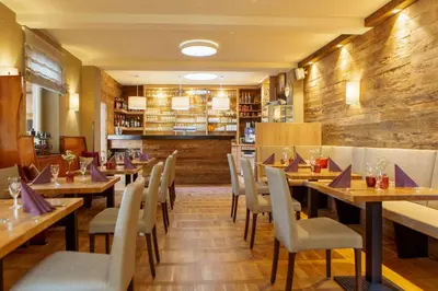 Ein Restaurant oder anderes Speiselokal in der Unterkunft Hotel Ettrich & Elbresort Rathen