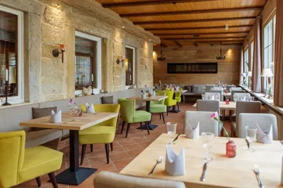 Ein Restaurant oder anderes Speiselokal in der Unterkunft Hotel Ettrich & Elbresort Rathen