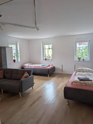Ein Bett oder Betten in einem Zimmer der Unterkunft Brick House