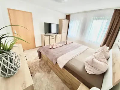 Ein Bett oder Betten in einem Zimmer der Unterkunft Ferienwohnungen Grimma 5