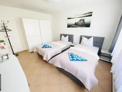 Ein Bett oder Betten in einem Zimmer der Unterkunft Ferienwohnungen Grimma 5