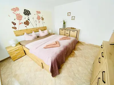 Ein Bett oder Betten in einem Zimmer der Unterkunft Ferienwohnungen Grimma 5