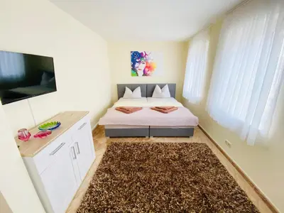 Ein Bett oder Betten in einem Zimmer der Unterkunft Ferienwohnungen Grimma 5
