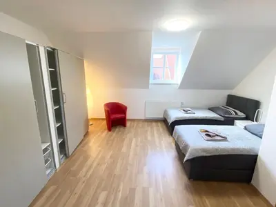 Ein Bett oder Betten in einem Zimmer der Unterkunft Ferienwohnungen Grimma 6
