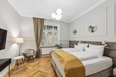 Ein Bett oder Betten in einem Zimmer der Unterkunft Residenz Hugo