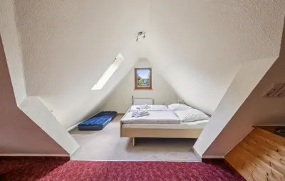 Ein Bett oder Betten in einem Zimmer der Unterkunft Ferienwohnung Neuhermsdorf