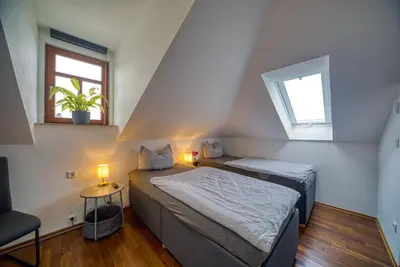 Ein Bett oder Betten in einem Zimmer der Unterkunft Villa-Harmonie Dresden