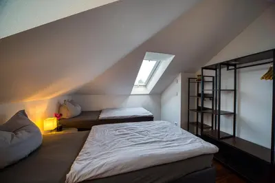 Ein Bett oder Betten in einem Zimmer der Unterkunft Villa-Harmonie Dresden