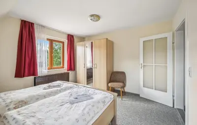 Ein Bett oder Betten in einem Zimmer der Unterkunft Ferienwohnung Neuhermsdorf