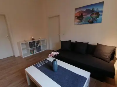 Ein Sitzbereich in der Unterkunft Ferienwohnung und Zimmervermietung Zur Alten Post