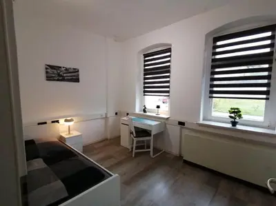 Ein Sitzbereich in der Unterkunft Ferienwohnung und Zimmervermietung Zur Alten Post
